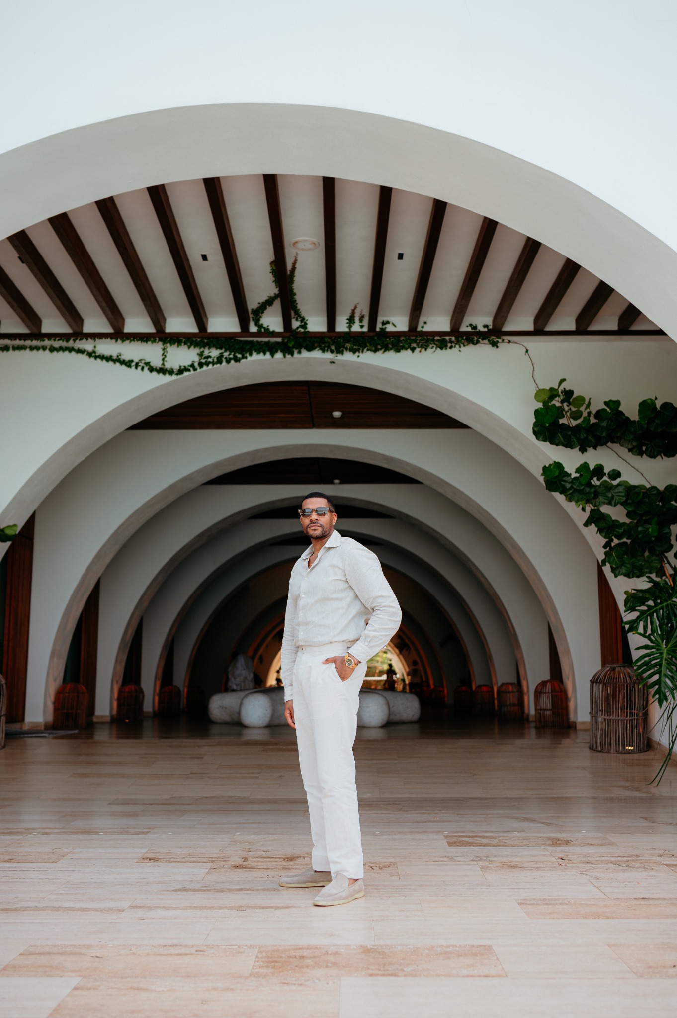 Corey Williams standing beneath architectural arches
